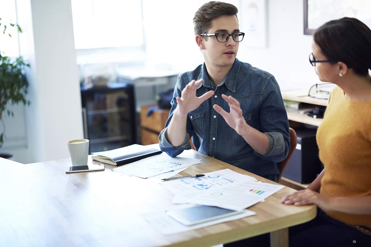 Two people discussing a strategy.